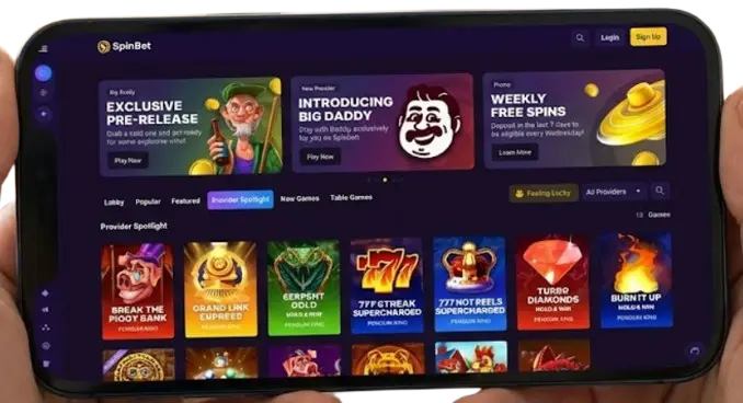SpinBet mobile casino lobby on a smartphone, showing popular slot games.